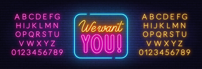 We want you neon sign on brick wall background.