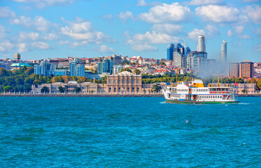 Sea voyage with old ferry (steamboat) in the Bosporus - Dolmabahce Palace  seen from the Bosphorus...