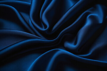 Fototapeta premium Abstract dark blue silk texture background