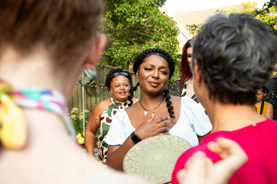 Friends and family arriving at a summer garden party