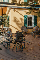 Garden Furniture For Leisure Time In Nature. Empty Chairs And Table Table In Orchard. Wooden Outdoor Furniture Set For Picnic In Autumn Garden. Cozy Interior Courtyard With Table And Chair In Village