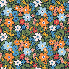 Beautiful floral pattern in small abstract flowers. Small colorful flowers. Dark blue background. Ditsy print. Floral seamless background. Liberty template for fashion prints. Stock pattern.