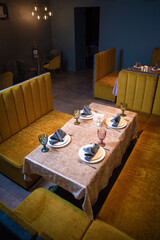 Elegant restaurant interior with yellow booths for fine dining and special events.
