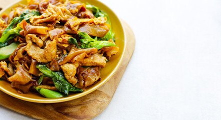 Stir-fried rice noodles with soy sauce and pork