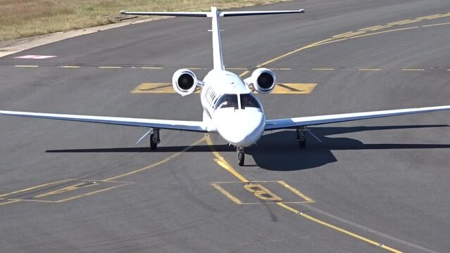 Business Airplane Generic White Unmarked Taxiing close up at airport
