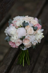 wedding bouquet, white peony and david austin roses. Fresh flowers. Wedding floristic.