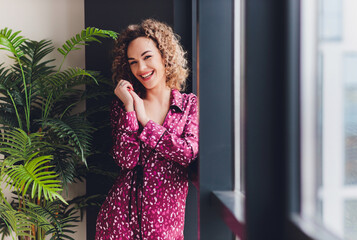 Woman on Hotel Bed Covering Self With Sheet.
