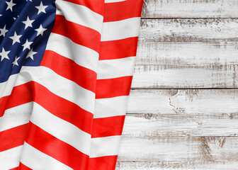 American flag on a rustic wooden background, top view, copy space. Symbol of independence,...