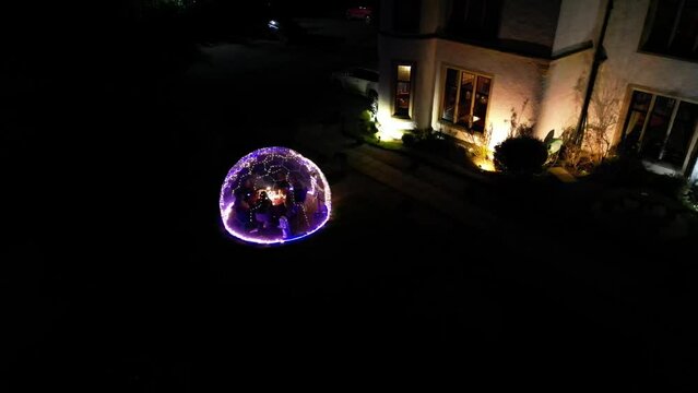 Luxury Hotel Heated Bubble Iglo Dining Lunch Dinner Dark Night panning shot