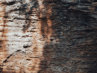 Brown cave wall stone texture for nature background.
