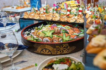 Delectable buffet spread of seafood, sushi, salads, fruit, and pastries.