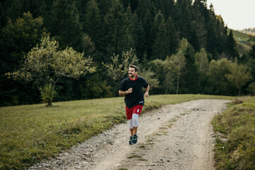 Male jogger in mountainous terrain, staying active and healthy