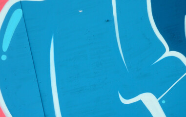Colorful background of graffiti painting artwork with bright aerosol outlines on wall. Old school...