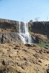 Obraz premium A beautiful waterfall in the midst of perfect nature in the forest.