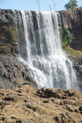 Obraz premium A beautiful waterfall in the midst of perfect nature in the forest.