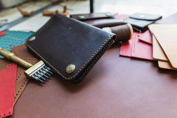 Leather wallet handmade working craftmanship background