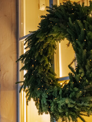 Beautiful Christmas wreath on the window