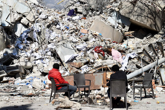 People waiting for their relatives next to collapsed buildings after the earthquake. Destroyed buildings after the earthquake in Turkey. Earthquake scenes from Kahramanmaraş and Hatay.
