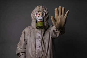 soldier in a protective suit with a gas mask