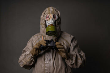 soldier in a protective suit with a gas mask