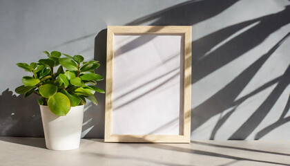 enhancing the mockup overlay in a horizontal, two vertical sheets of textured white paper against a soft gray table background. the natural light creates subtle shadows from an with leaves on table