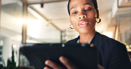 Business, black woman and tablet at night in office to search internet, scroll information and...