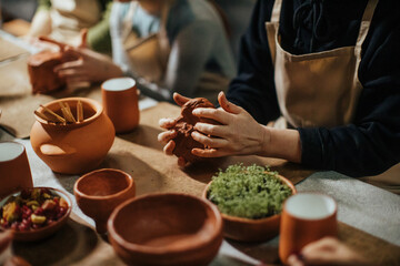 handmade clay potter making with hands - Powered by Adobe
