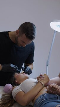 Beautiful brunette woman jumps in pain from injection