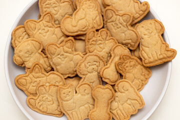 treat for dogs. a plate of cookies with figures of dogs and bones