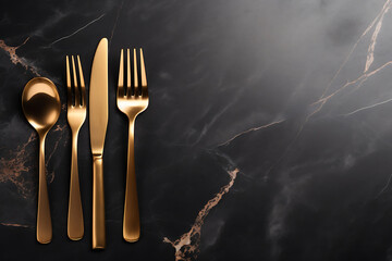Empty black plate with golden cutlery on black marble background. - obrazy, fototapety, plakaty