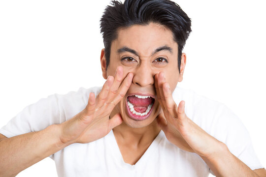 Closeup of an angry screaming man isolated on white background 