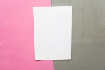 White mockup blank on gray and pink geometric paper background texture
