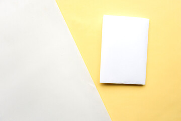 White mockup blank on geometric yellow and white paper background texture