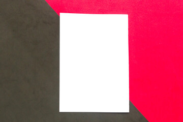 White mockup blank on red and black geometric paper background