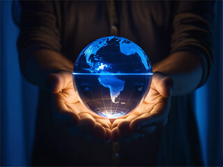 Person is holding a blue, glowing map of the world . The globe appears to be illuminated with blue lights and hand glowing with light