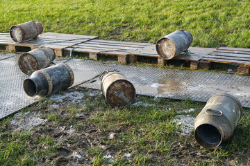 Old milk cans lying around. Carbide shooting is a tradition in the Netherlands and usually takes place on New Year's Eve. The goal is to make a loud bang after the carbide gas is ignited	