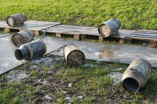 Old milk cans lying around. Carbide shooting is a tradition in the Netherlands and usually takes place on New Year's Eve. The goal is to make a loud bang after the carbide gas is ignited	