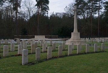 Fototapeta premium Stahnsdorf, Germany - Jan 22, 2024: This Commonwealth war cemetery contains the graves of 1,176 Commonwealth solders who lost their lives during the First World War. Cloudy winter day. Selective focus