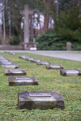 Berlin, Germany - Jan 22, 2024: The Zehlendorf cemetery contains a large plot with 1166 Italian war graves from the Second World War. Cloudy winter day. Selective focus
