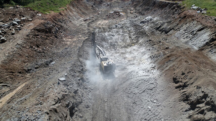 construction machines at works, dozer, roller machine, excavator, crawler rock drill machine, trucks, GPS grader