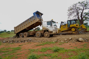 Obraz premium construction machines at works, dozer, roller machine, excavator, crawler rock drill machine, trucks, GPS grader