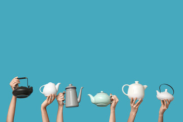Women with teapots on blue background