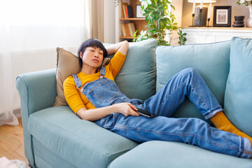 Woman taking a nap on living room couch