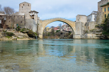 View of the Old Bridge in Mostar city in Bosnia and Herzegovina during a sunny day. Neretva river....