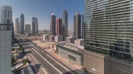 Fototapeta na wymiar Business bay district skyline with modern architecture morning timelapse from above.