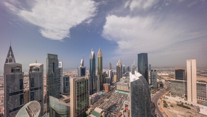 Fototapeta na wymiar Skyline view of the high-rise buildings on Sheikh Zayed Road in Dubai aerial all day timelapse, UAE.