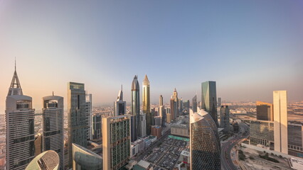 Skyline view of the high-rise buildings on Sheikh Zayed Road in Dubai aerial all day timelapse, UAE.