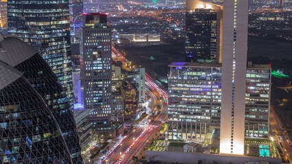Skyline view of the high-rise buildings in International Financial Centre in Dubai aerial day to night timelapse, UAE.