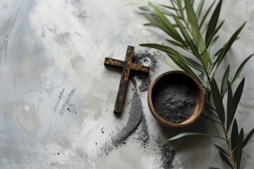 Ash Wednesday,faith, liturgy, religious ceremony background. Wooden cross, ceremonial dish with ash and olive leaf branch on gray background. Top view