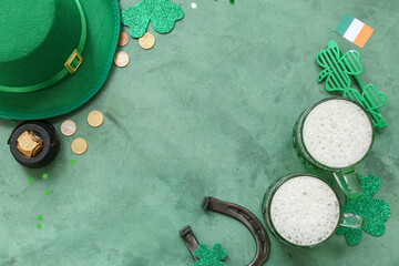 Frame made of glasses of beer with coins, horseshoe and leprechaun hat on green background. St....